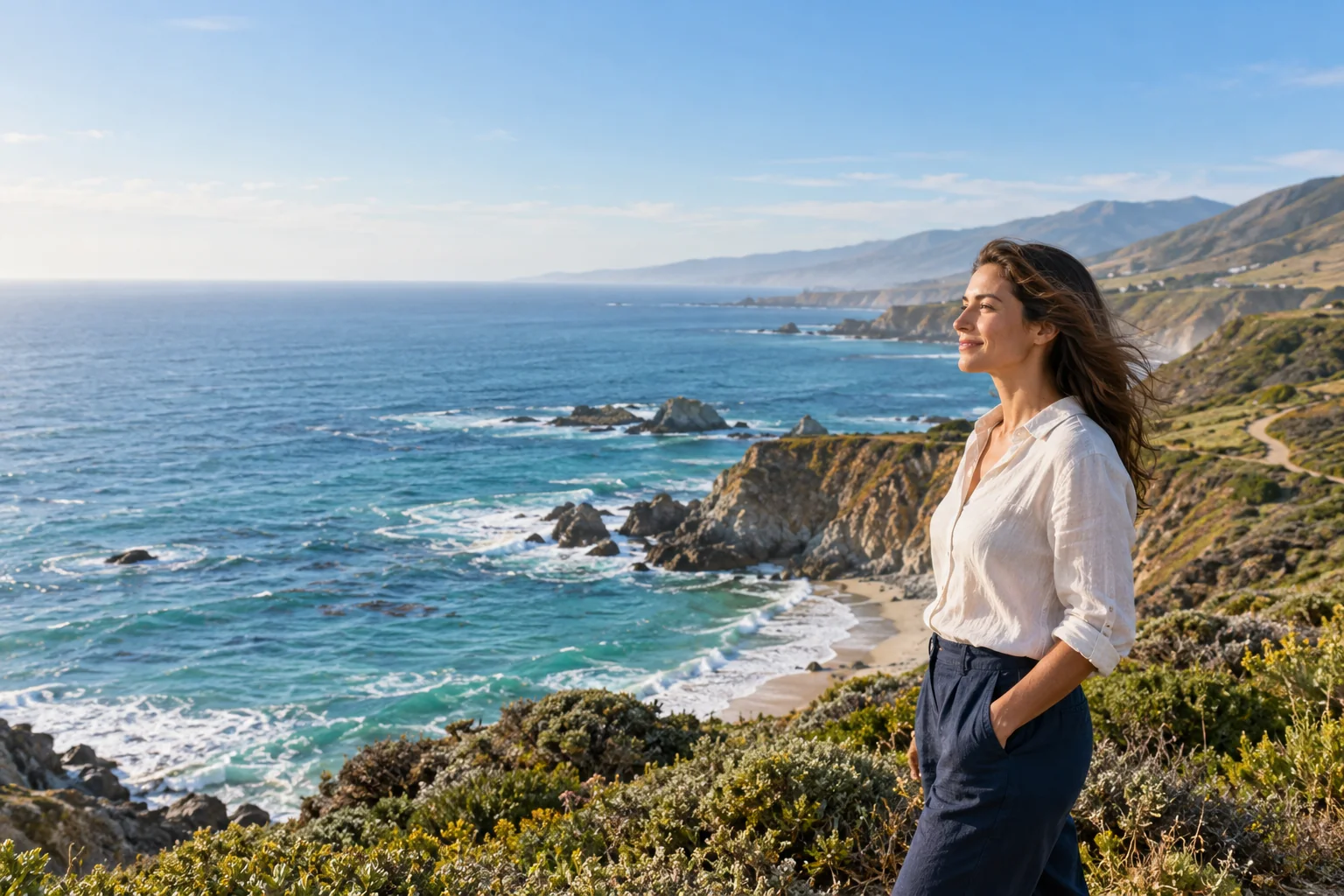 Illustrative woman taking in a sunlit Pacific coastline